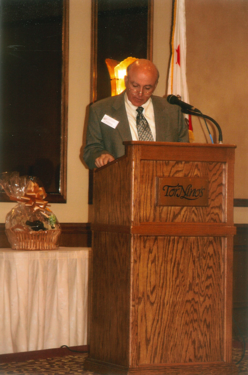 Denis speaking at the 2010 Annual Meeting.